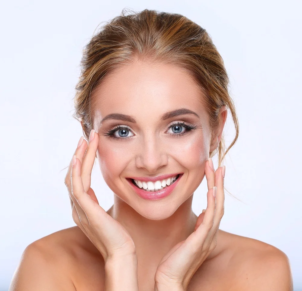 woman with smooth glowing skin and well shaped eyebrows